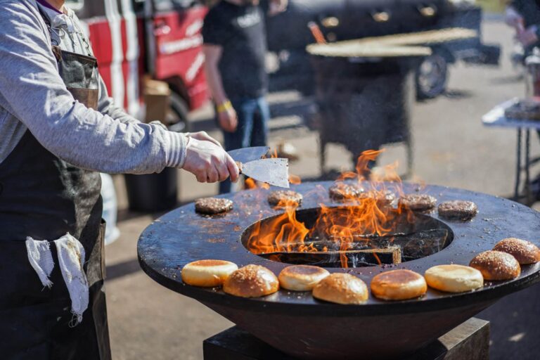 young-man-cooking-burgers-on-fire-2025-01-08-14-20-54-utc.jpg